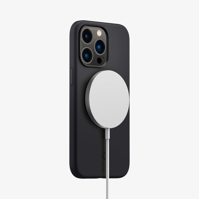 ACS04087 - iPhone 13 Pro Case Silicone Fit Mag (Mag Fit) in black showing the back and partial side with mag charger connected