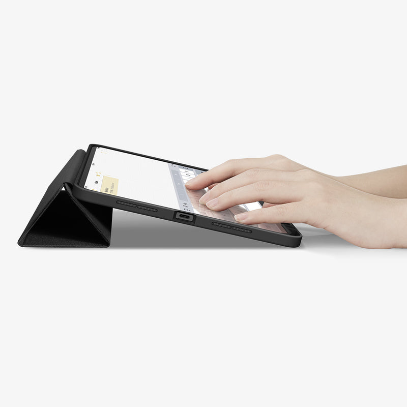 ACS07020 - iPad Pro 11-inch Case Urban Fit in Black showing the partial front with a hand typing on the device with a folded front cover propped up as a stand