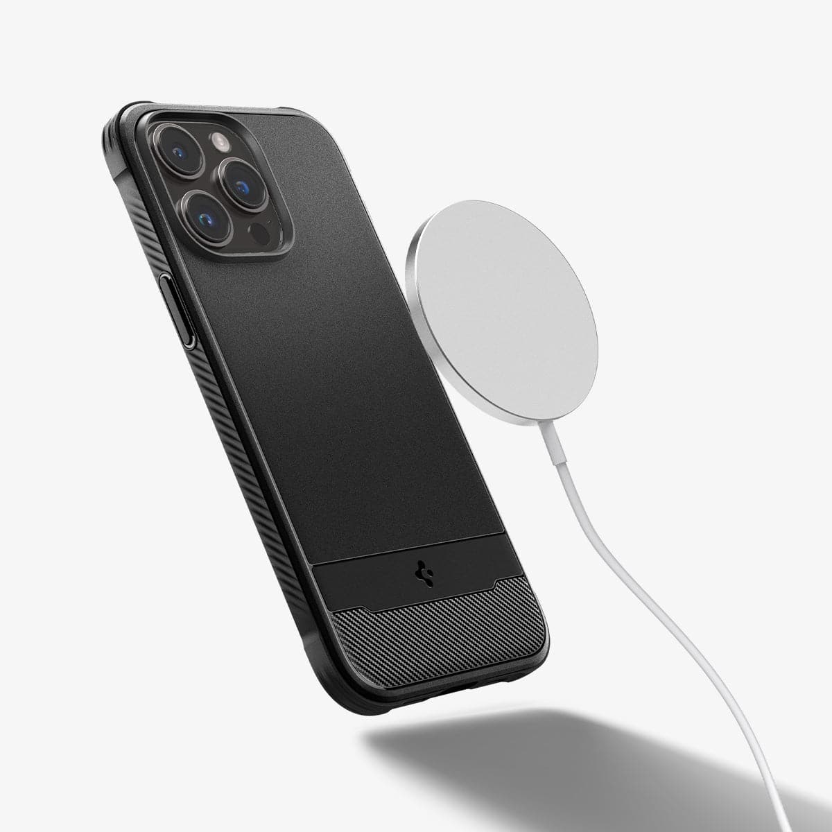 ACS04956 - iPhone 14 Pro Case Rugged Armor (MagFit) in matte black showing the back with magsafe charger hovering away from device