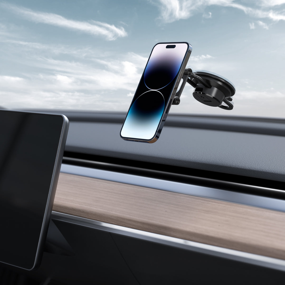 ACP04630 - OneTap 3 Black Dash/Wind Magnetic Car Mount (MagFit) in black showing the mount on glass inside of car with device on mount