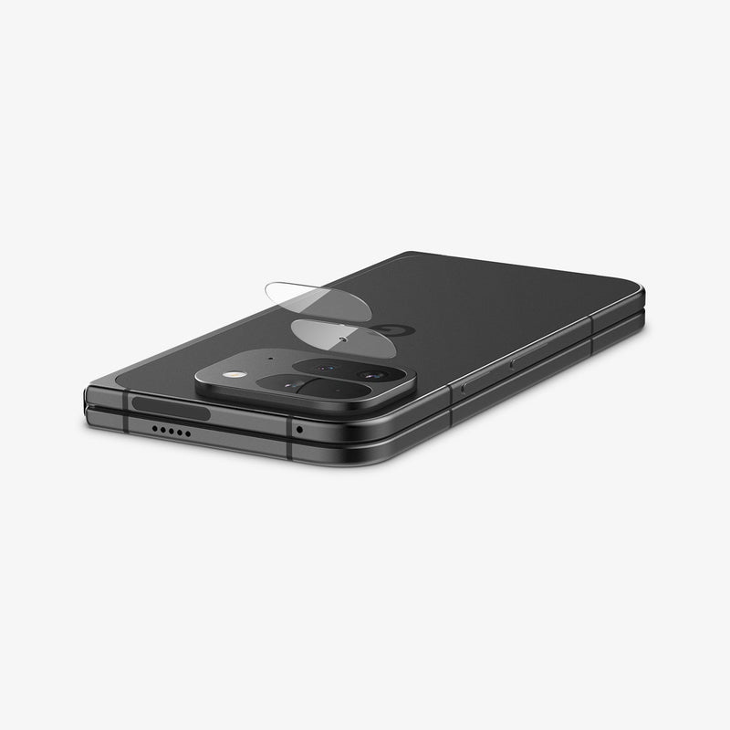 AGL08269 - Pixel 9 Pro Fold Optik EZ Fit Lens Protector in Crystal Clear showing the lens protector partially hovering in front of the camera lens