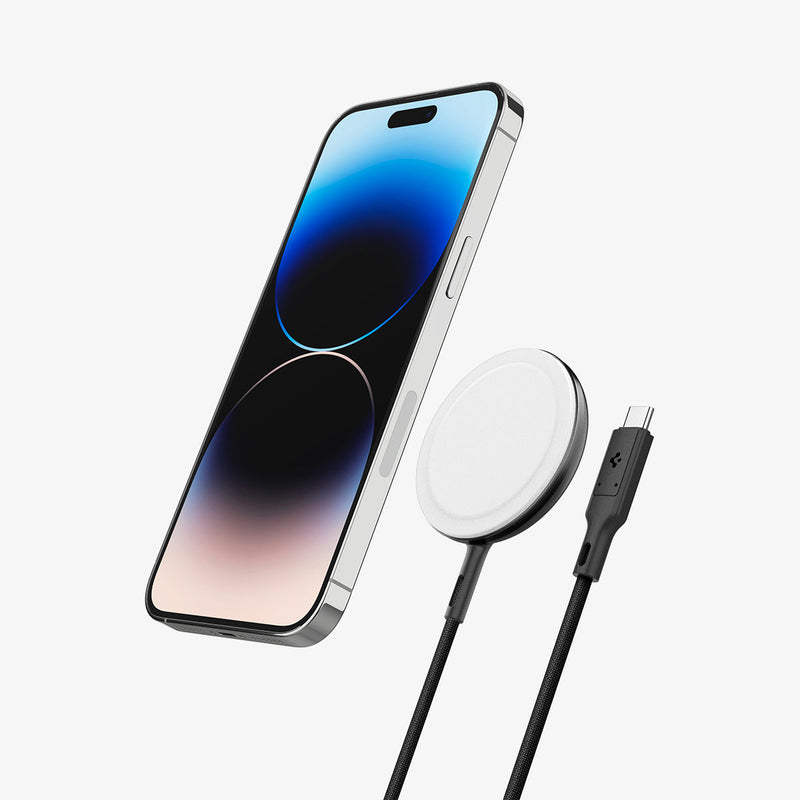 ACH05429 - ArcField™ Magnetic 15W Wireless Charger PF2200 (MagFit) in Black showing the front of device hovering its back from a Magsafe charger and a charger connector cord