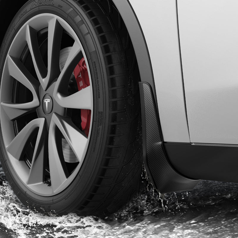 ACP04512 - Tesla Model Y WeatherBloc Mud Flaps showing the mud flaps installed and water hitting it