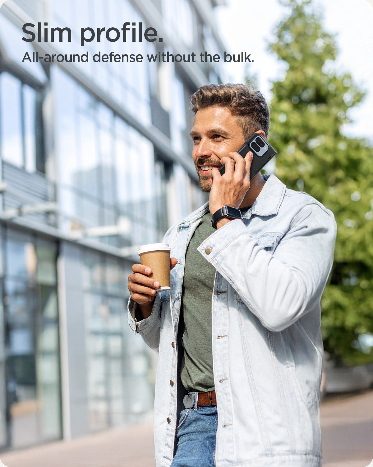 ACS09741 - GajPFD Case Slim Armor Pro (MagFit) in black showing a man talking on the phone. Slim profile and all-around defense without the bulk.