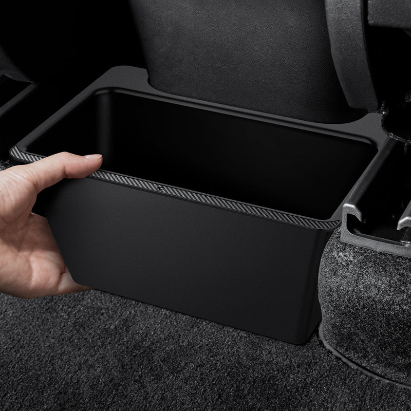 ACP05758 - TO223 Tesla Model Y Rear Storage Box in black showing a hand installing inside of car