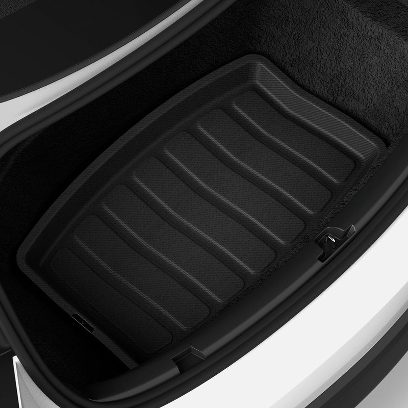 ACP07612 - Tesla Model 3 Highland Trunk Mat Liner TLT-3H in Black showing the front of a mat liner installed inside a vehicle's mini compartment