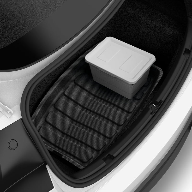 ACP07612 - Tesla Model 3 Highland Trunk Mat Liner TLT-3H in Black showing the front, installed inside a vehicle's compartment