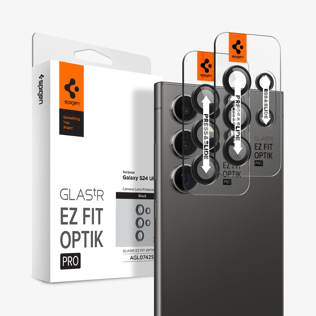AGL07425 - Galaxy S24 Ultra Optik Pro EZ Fit Lens Protector in Black showing the camera lens protector hovering above another lens protector tray and device showing back, behind it, is the packaging